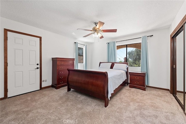9349 Hartman Way, West Hills, CA 91304 - bedroom featuring light colored carpet, a textured ceiling, and ceiling fan