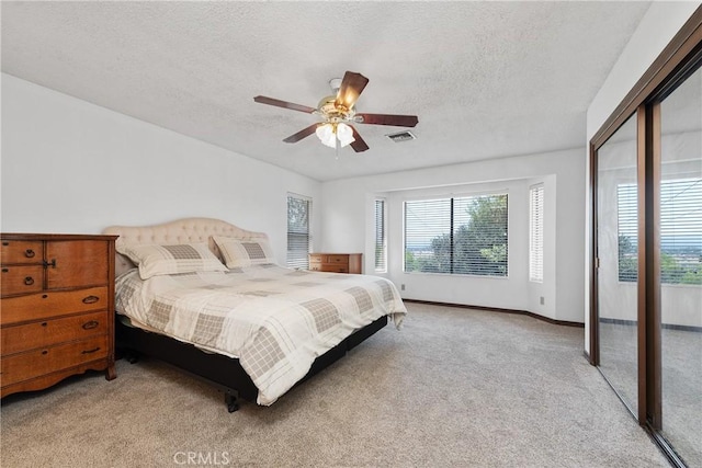 9349 Hartman Way, West Hills, CA 91304 - bedroom with light carpet, a textured ceiling, and ceiling fan