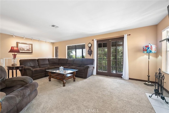 9349 Hartman Way, West Hills, CA 91304 - living area with rail lighting, carpet floors, and french doors