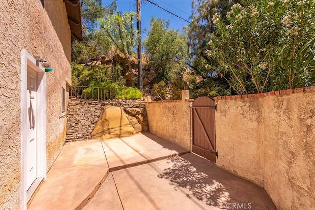 9349 Hartman Way, West Hills, CA 91304 - view of patio with a gate