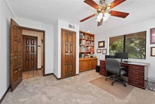 9349 Hartman Way, West Hills, CA 91304 - home office with a textured ceiling, light colored carpet, and ceiling fan