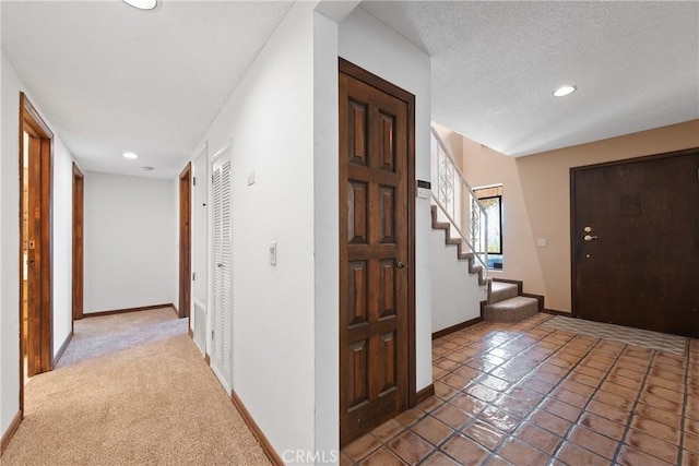 9349 Hartman Way, West Hills, CA 91304 - foyer featuring stairway, recessed lighting, light tile patterned flooring, and a textured ceiling