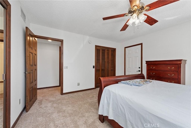 9349 Hartman Way, West Hills, CA 91304 - bedroom featuring light colored carpet, a closet, ceiling fan, and a textured ceiling