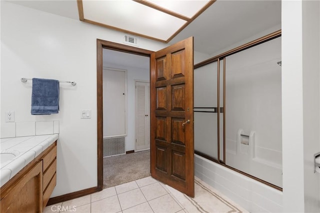 9349 Hartman Way, West Hills, CA 91304 - full bathroom featuring enclosed tub / shower combo, vanity, and tile patterned floors