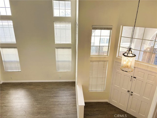 493 Hillsborough Way, Corona, CA 92879 - foyer entrance featuring dark wood-type flooring, a towering ceiling, and a chandelier