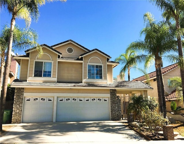 493 Hillsborough Way, Corona, CA 92879 - traditional-style house with a garage, concrete driveway, and stone siding