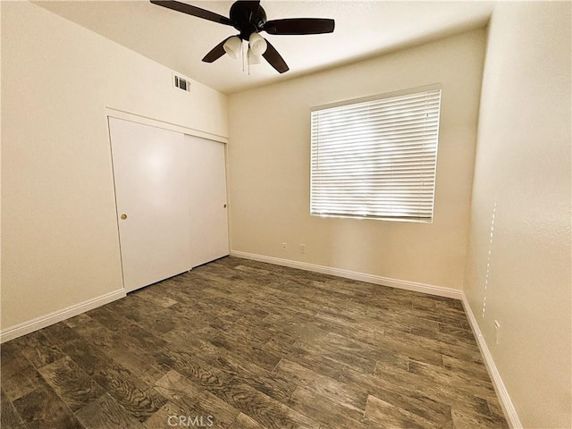 493 Hillsborough Way, Corona, CA 92879 - unfurnished bedroom with dark wood finished floors, a closet, and ceiling fan