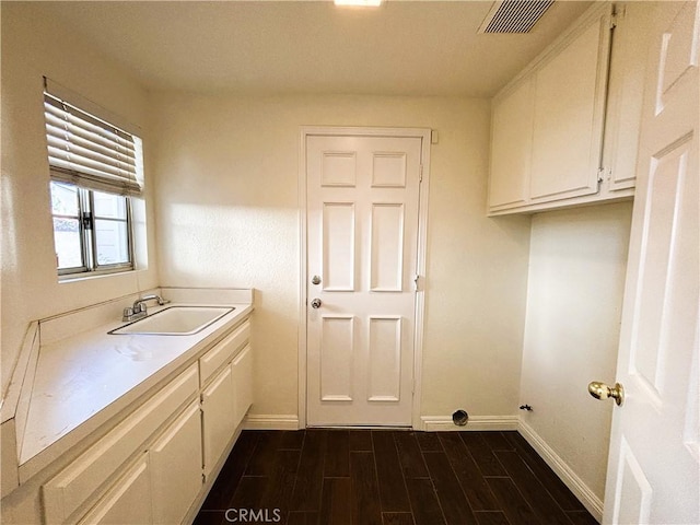 493 Hillsborough Way, Corona, CA 92879 - laundry area with cabinet space and dark wood-style flooring