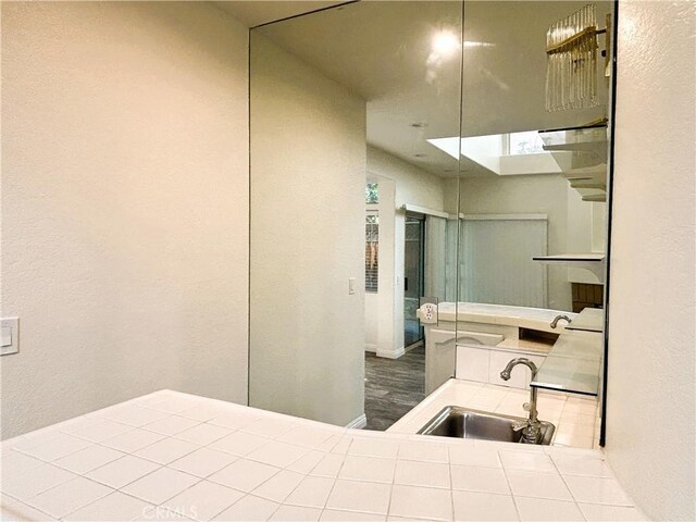 493 Hillsborough Way, Corona, CA 92879 - bathroom featuring a sink and a textured wall