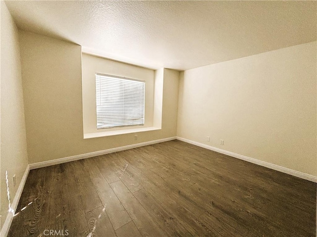 493 Hillsborough Way, Corona, CA 92879 - spare room with dark wood-style flooring and a textured ceiling