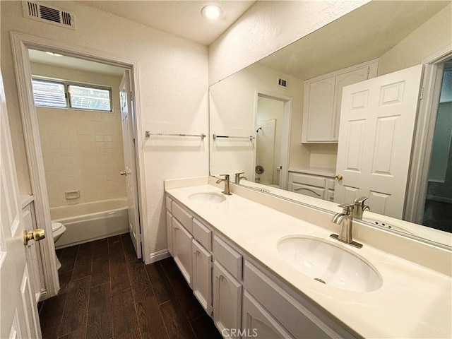 493 Hillsborough Way, Corona, CA 92879 - bathroom with wood finished floors, double vanity, and washtub / shower combination