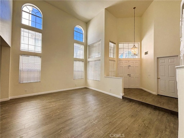 493 Hillsborough Way, Corona, CA 92879 - entrance foyer with a high ceiling, dark wood-style flooring, healthy amount of natural light, and a chandelier