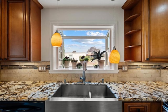 3621 Vista Campana S Unit 54, Oceanside, CA 92057 - kitchen featuring open shelves, decorative backsplash, and light stone countertops