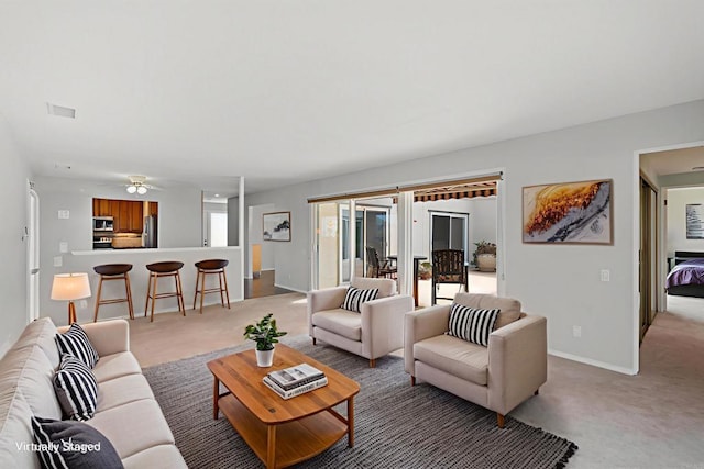 3621 Vista Campana S Unit 54, Oceanside, CA 92057 - living area with light carpet and a ceiling fan