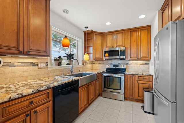 3621 Vista Campana S Unit 54, Oceanside, CA 92057 - kitchen featuring appliances with stainless steel finishes, brown cabinetry, light tile patterned floors, decorative backsplash, and light stone counters