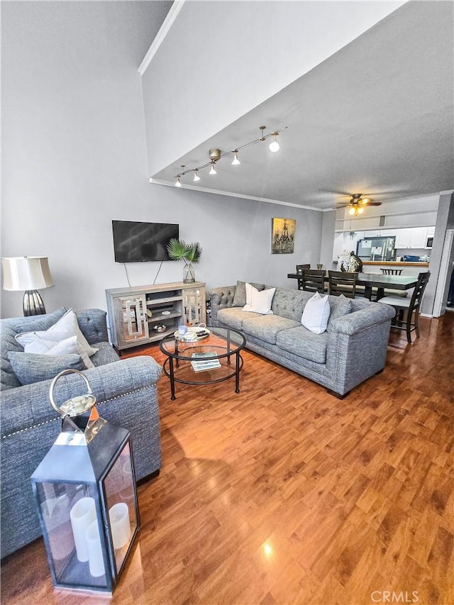 10659 Lakefront Dr, Norwalk, CA 90650 - living room with wood finished floors, ceiling fan, and ornamental molding