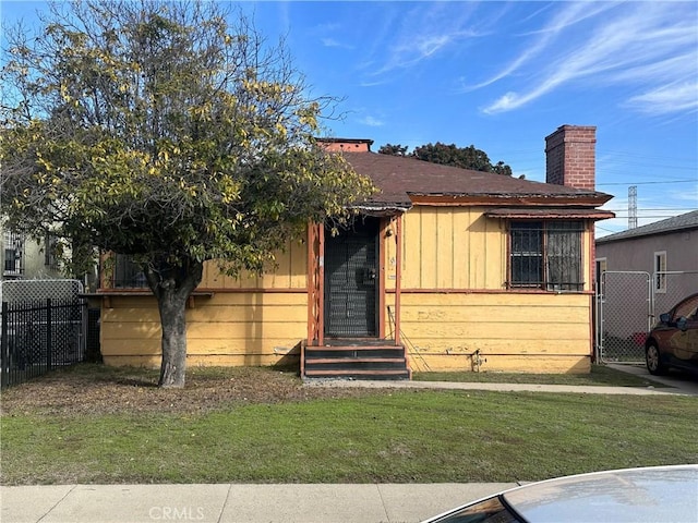 551 W 101st St, Los Angeles, CA 90044 - view of front of house with a chimney