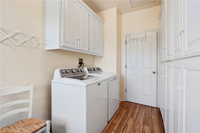 6600 San Gabriel Rd, Atascadero, CA 93422 - laundry area with independent washer and dryer, cabinet space, and wood finished floors