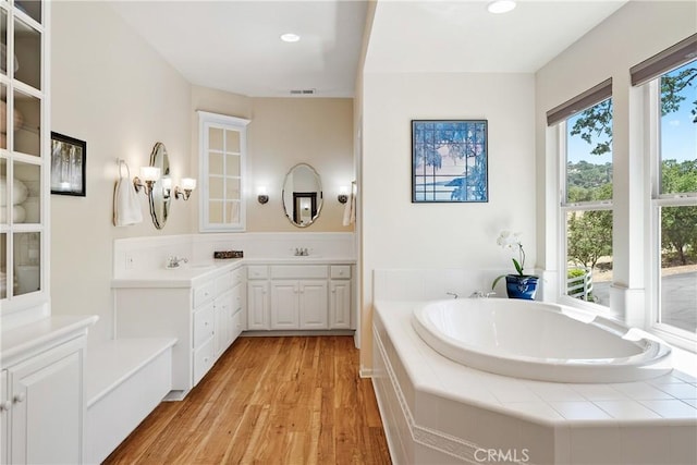 6600 San Gabriel Rd, Atascadero, CA 93422 - bathroom featuring a bath, wood finished floors, vanity, recessed lighting, and a chandelier