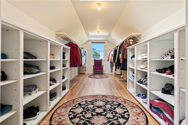 6600 San Gabriel Rd, Atascadero, CA 93422 - spacious closet featuring a skylight, lofted ceiling, and wood finished floors