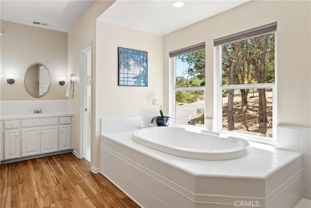 6600 San Gabriel Rd, Atascadero, CA 93422 - bathroom featuring vanity, a bath, and wood finished floors