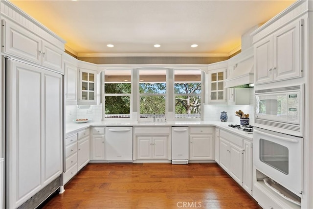 6600 San Gabriel Rd, Atascadero, CA 93422 - kitchen with built in appliances, glass insert cabinets, crown molding, white cabinetry, and tasteful backsplash