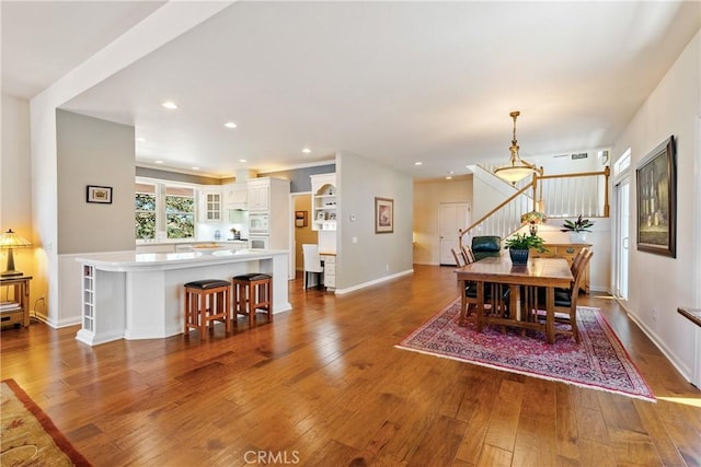6600 San Gabriel Rd, Atascadero, CA 93422 - dining area featuring stairs, hardwood / wood-style flooring, recessed lighting, and a chandelier