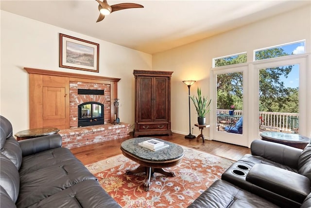 6600 San Gabriel Rd, Atascadero, CA 93422 - living room with a ceiling fan, wood finished floors, and a brick fireplace