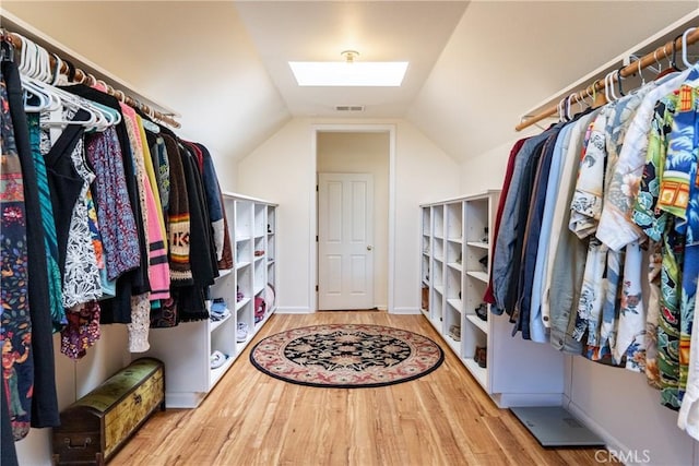 6600 San Gabriel Rd, Atascadero, CA 93422 - spacious closet with a skylight, wood finished floors, and vaulted ceiling