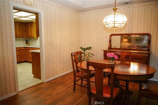 2787 Grape Way, Chico, CA 95973 - dining space with light wood-style flooring and a chandelier