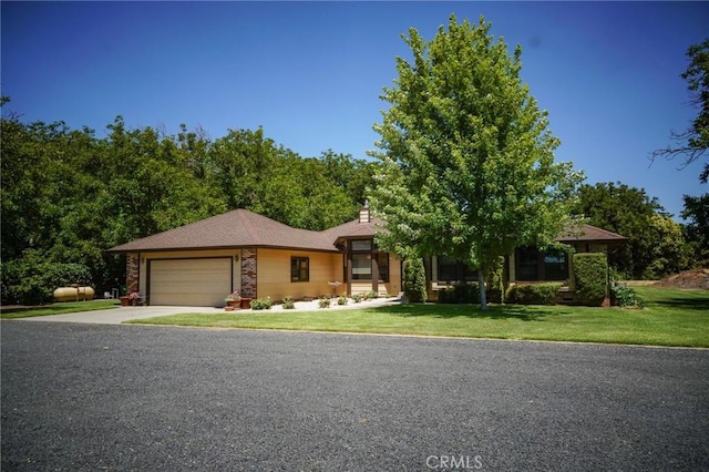 2787 Grape Way, Chico, CA 95973 - view of front of house with a garage, concrete driveway, a front yard, and a chimney