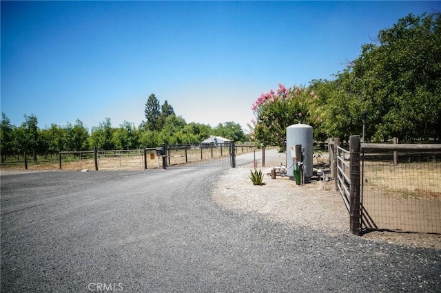 2787 Grape Way, Chico, CA 95973 - view of dirt / gravel driveway featuring a gate and a view of countryside