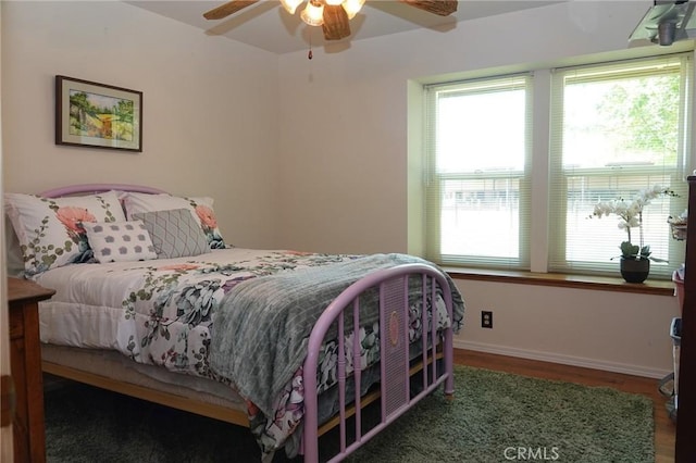 2787 Grape Way, Chico, CA 95973 - bedroom featuring multiple windows, wood finished floors, and ceiling fan