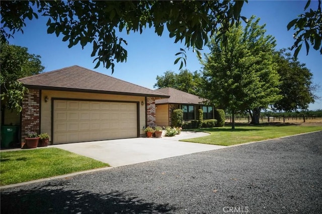 2787 Grape Way, Chico, CA 95973 - ranch-style home featuring brick siding, an attached garage, a front lawn, concrete driveway, and a shingled roof