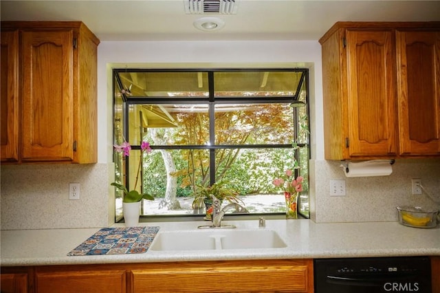 2787 Grape Way, Chico, CA 95973 - kitchen featuring dishwasher, light countertops, decorative backsplash, and brown cabinets