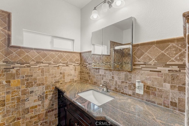 261 Twickenham Ave, Los Angeles, CA 90022 - bathroom featuring vanity, a stall shower, tile walls, and wainscoting
