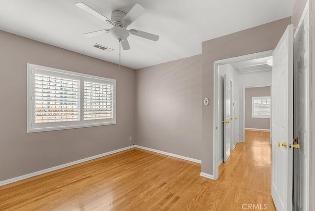 261 Twickenham Ave, Los Angeles, CA 90022 - unfurnished room featuring light wood-style flooring, ceiling fan, and attic access