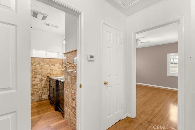 261 Twickenham Ave, Los Angeles, CA 90022 - corridor featuring light wood-style floors