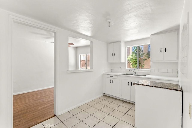 261 Twickenham Ave, Los Angeles, CA 90022 - kitchen featuring white cabinetry and light tile patterned floors