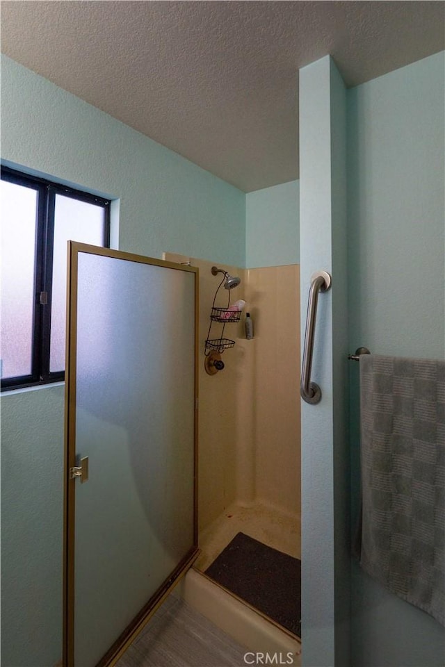 25967 Pleasant St, Hemet, CA 92544 - bathroom featuring a stall shower and a textured ceiling