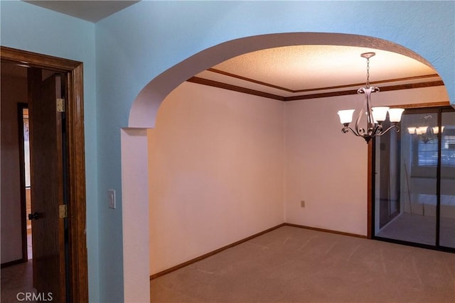 25967 Pleasant St, Hemet, CA 92544 - unfurnished room with arched walkways, carpet floors, a chandelier, and crown molding
