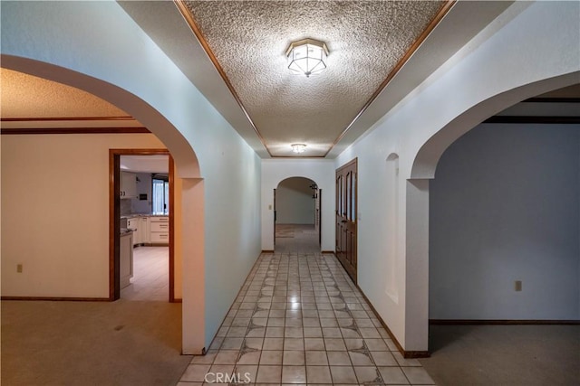25967 Pleasant St, Hemet, CA 92544 - corridor featuring a textured ceiling, light tile patterned flooring, and arched walkways