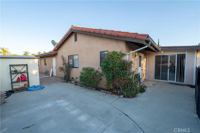 25967 Pleasant St, Hemet, CA 92544 - rear view of house with a patio area, stucco siding, and an outdoor structure