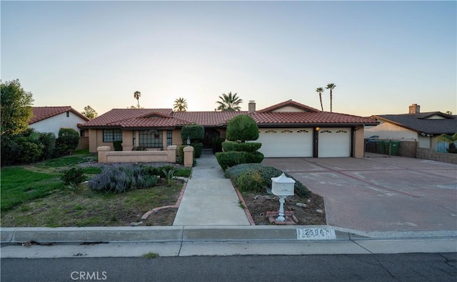 25967 Pleasant St, Hemet, CA 92544 - view of front facade with a tiled roof, an attached garage, concrete driveway, and stucco siding