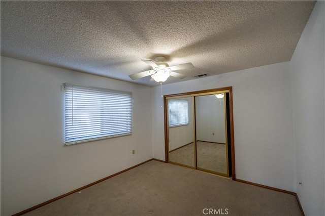 25967 Pleasant St, Hemet, CA 92544 - unfurnished bedroom featuring a closet, carpet floors, a textured ceiling, and ceiling fan