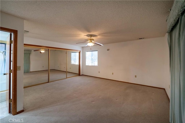 25967 Pleasant St, Hemet, CA 92544 - unfurnished bedroom featuring light colored carpet, a textured ceiling, and ceiling fan