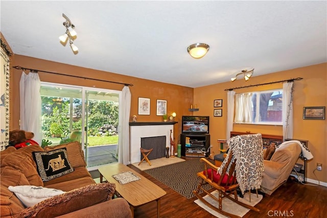 2734 Grove St, La Verne, CA 91750 - living room featuring wood finished floors, plenty of natural light, and a fireplace