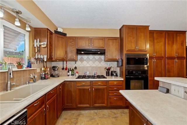2734 Grove St, La Verne, CA 91750 - kitchen featuring black oven, stainless steel microwave, gas stovetop, dishwasher, and under cabinet range hood
