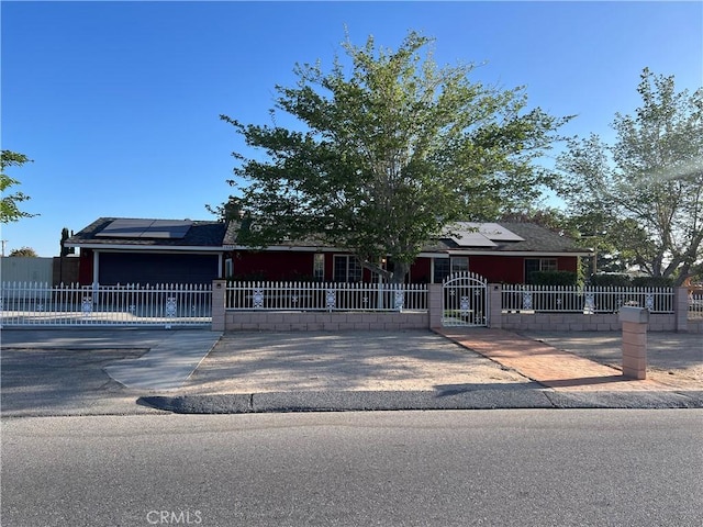 14680 Luna Rd, Victorville, CA 92392 - view of front facade with a fenced front yard and roof mounted solar panels