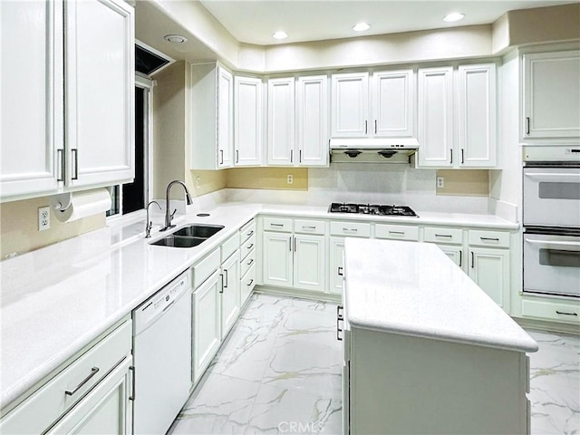19861 Sunset Vista Rd, Walnut, CA 91789 - kitchen featuring white appliances, light marble finish floors, under cabinet range hood, white cabinetry, and light countertops